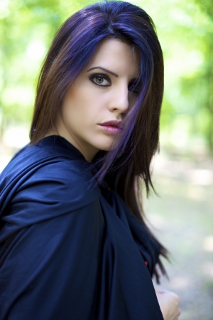 Beautiful woman with blue hood like fairy taleの写真素材