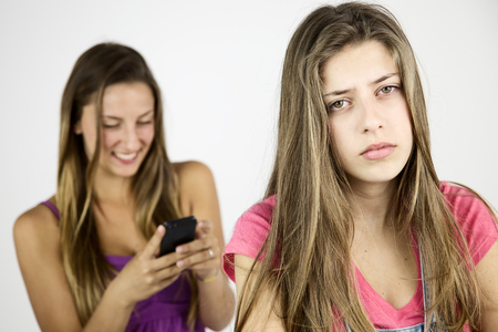 Unhappy teenager about bullying sisterの写真素材