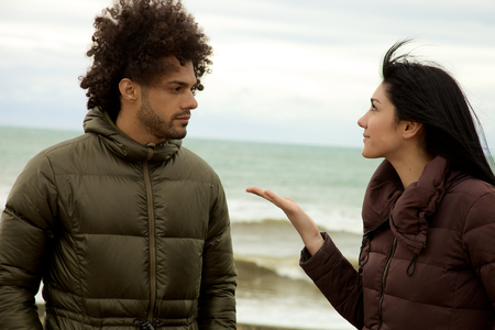 Unhappy couple discussing in winterの写真素材