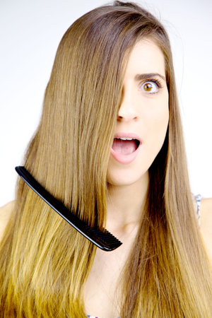 Young woman with amazing hair looking scared