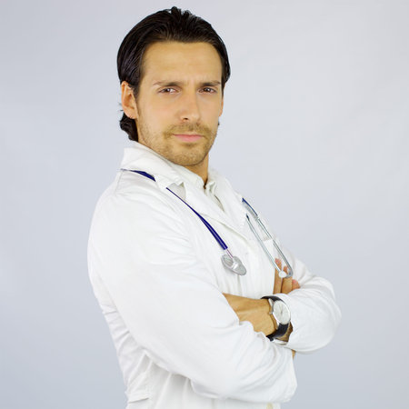 Cool young doctor looking camera