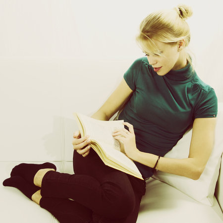 Gorgeous blond lady reading book