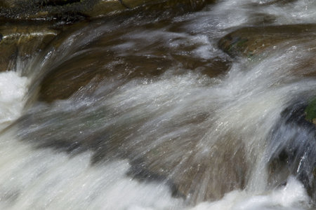 Rushing waters pouring over rocks of Bedford River on Newfoundland's Avalon Peninsula