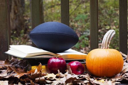 Autumn images combine with football and textbooks to reflect the preparation, academic and training, before the season's big gamesの写真素材