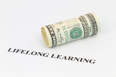 Lifelong learning in letters beneath American currency reflects its strategy as a smart business and...