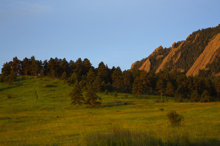 Distinctive slanted Flatirons, an iconic Boulder, Colorado view.  Landscape location is popular Chattaqua Park providing access to hiking trails.の写真素材
