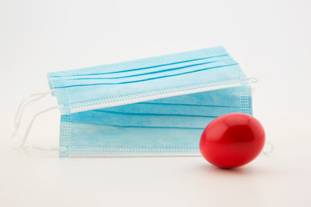 Masks and red egg reflect business danger in no strategic plan for the high costs of PPE, Personal...