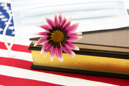 Accent on science for national  medical and pandemic guidelines emphasized by flower with Covid ...