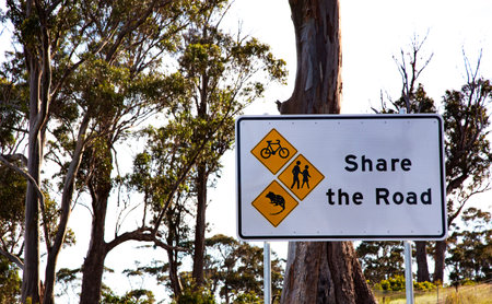 SHARE THE ROAD sign in Tasmania emphasizes need for drivers to watchout for the safety of bikers, walkers, and wildlifeの写真素材