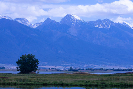 Beautiful view of snow capped Mission Mountains of Rocky Mountains along Olsen Road in Mission Valley region of Montanaの写真素材