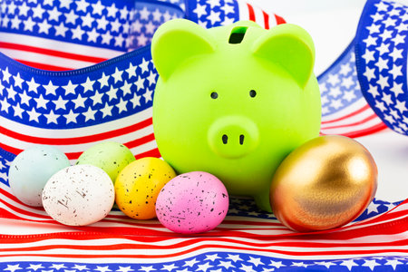Gold egg of success placed with green pig bank and mixed color eggs to symbolize strategic, diverse investments yielding financial profitsの写真素材