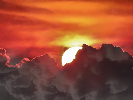 Sun covered by cloudsの写真素材