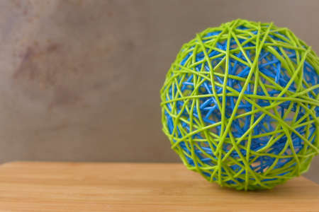 rubber ball of blue and green on right deskの写真素材