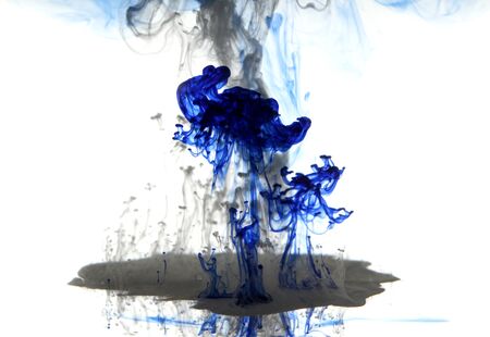 Blue and gray ink smoke under waterの写真素材