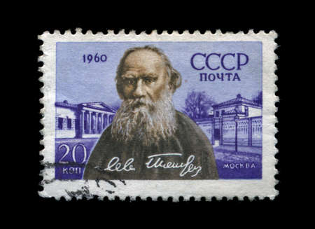 USSR - CIRCA 1960: cancelled stamp printed in USSR, shows famous russian writer Lev Tolstoy, circa 1960. vintage post stamp on black background.の写真素材