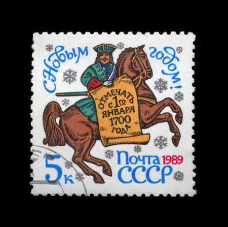 USSR - CIRCA 1988: cancelled stamp printed in the USSR, shows Petr Pervy (Piter First) with document for New Year holidays since 1700, circa 1988. Happy New Year 1989 as text.の写真素材