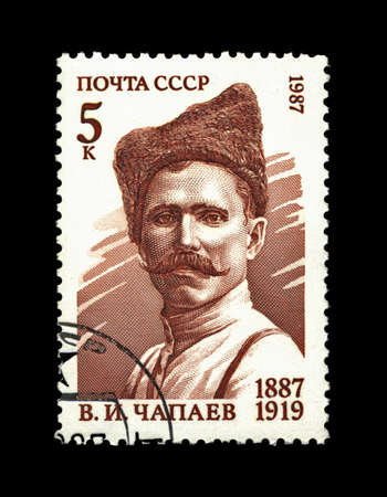 USSR - CIRCA 1987: cancelled stamp printed in the USSR, shows famous russian millitary commander Vasiliy Chapaev, circa 1987. civil war 1920s history. vintage post stamp on black background.の写真素材