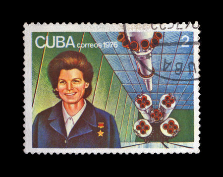 CUBA - CIRCA 1976: cancelled stamp printed in CUBA, shows first russian, soviet astronaut Valentina Tereshkova, rocket shuttle, circa 1976. vintage post stamp on black background.のeditorial素材