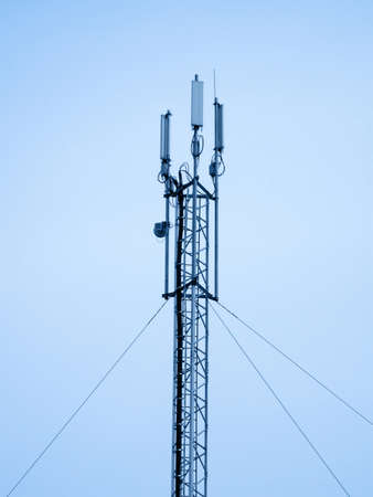 radio antenna for wireless mobile phone connections, night illustration. Danger microwave radiation. new satellite dish telecommunication technology concept.の写真素材