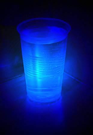 magic light over full tumber with water, radiation detailsの写真素材