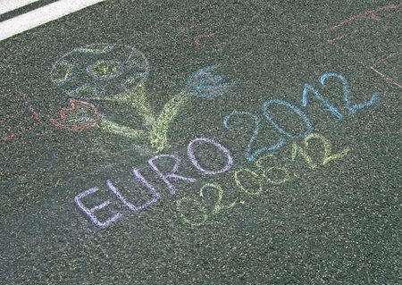 KIEV - JUNE 02: Euro 2012 football emblem painted by chalk (graffiti) on asphalt on June 02, 2012 in Kiev, UKRAINE. Sport sign devoted to EURO 2012 Football Championship in Ukraine and Poland in summer 2012.のeditorial素材