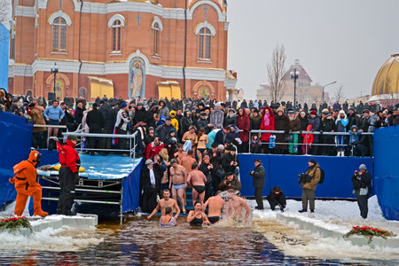 KIEV - JAN 19: Epiphany (Kreshchenya) morning near Svjato-Pokrovskiy Cathedral on January 19, 2013 in Kiev, Ukraine. People plunging into ice-cold water three times as it helps body became more resilient to illness. Epiphany known since 988 AD.のeditorial素材