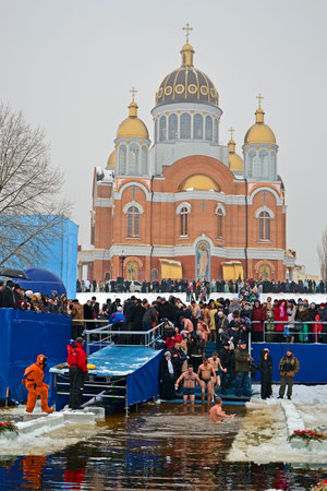 KIEV - JAN 19: Epiphany (Kreshchenya) morning on January 19, 2013 in Kiev, Ukraine. People plunging into ice-cold water three times as it helps body became more resilient to illness. Epiphany known since 988 AD.のeditorial素材