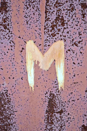 focus on center  restroom  toilet  for man sign on rustical metal surface, vintage detailsの写真素材