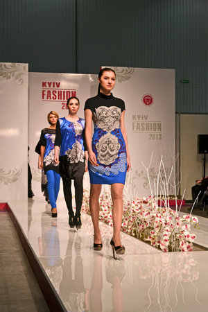 KIEV - FEB 19: Kyiv Fashion 2013 International exibition (February 19-22) in Kiev, Ukraine on February 19, 2013. Young women demonstrate new clothing collection 2013.のeditorial素材