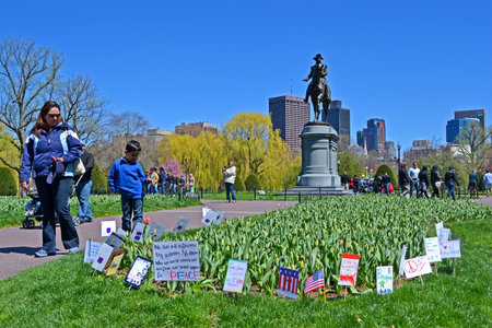 BOSTON - APR 21: Support flags near Washington monument in Public Garden in Boston, USA on April 21, 2013. Boston Marathon bombing take part on April 15, 2013. More 27000 runners take part in marathon, 3 were killed and over 100s were injured.のeditorial素材