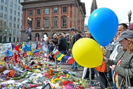 BOSTON - APR 20: People poured over the memorial set up on Boylston Street in Boston, USA on April...
