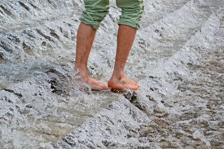 waterfall, foots in the water, environment detailsの写真素材
