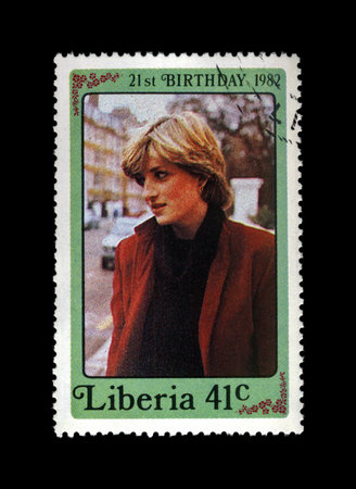 LIBERIA - CIRCA 1982: cancelled stamp printed in Liberia shows 21st Birthday of princess Diana, circa 1982. vintage post stamp isolated on black background.のeditorial素材