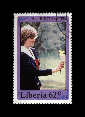 LIBERIA - CIRCA 1982: cancelled stamp printed in Liberia shows 21st Birthday of princess Diana, circa 1982. vintage post stamp isolated on black background.のeditorial素材