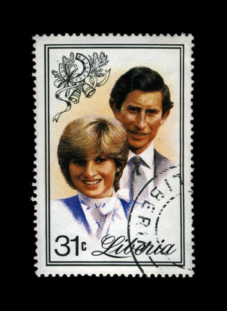 LIBERIA - CIRCA 1982: cancelled stamp printed in Liberia shows marriage of Lady Diana Spencer and Prince Charles, circa 1982. vintage post stamp isolated on black background.のeditorial素材