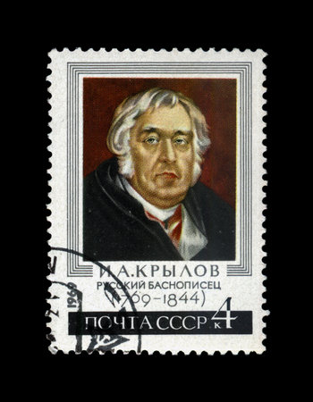 USSR - CIRCA 1969: canceled stamp printed in USSR shows famous fable writer Ivan Krylov (1769-1844), circa 1969. vintage post stamp isolated on black background.のeditorial素材