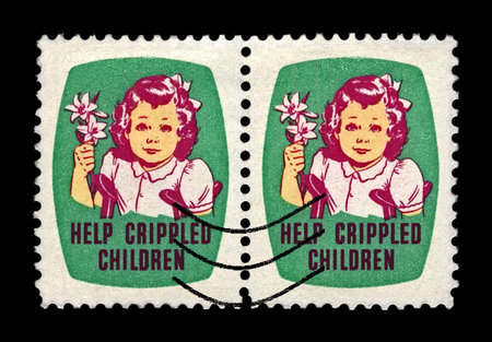s Help Crippled children. Girl with Easrer lily flower. canceled stamp printed in USA. Easter Seals Stamp aka Christmas seals since 1919, circa 1950. vintage postage stamp isolated on black background.のeditorial素材