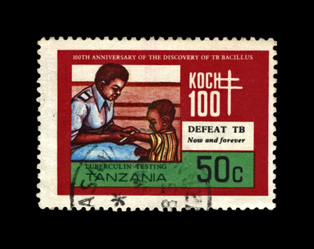 child immunization. Anniversary of tuberculosis scientist, explorer, tubercle bacillus discoverer Robert Koch (1843-1910), circa 1982. vintage post stamp printed in Tanzania isolated on black background.のeditorial素材