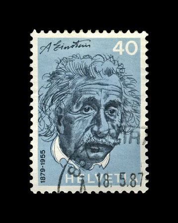 Albert Einstein, famous scientist, physicist, Nobel prize winner, circa 1972. vintage canceled post stamp printed in Switzerland isolated on black background.のeditorial素材