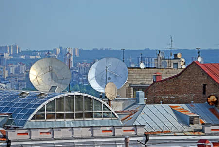 satellite dish heap on the building roof, modern telecommunication diversityの写真素材