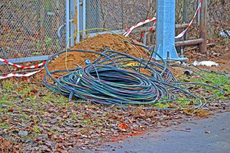 focus on center cable. abandoned color industrial electric cable bulk, modern power industry...