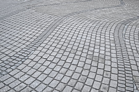 brick stone pavement closeup, modern travel diversity