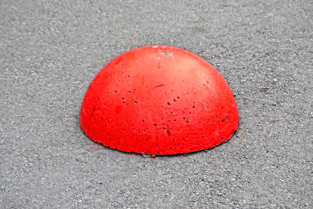 red damaged stone pylon barrier on the street, modern security diversityの写真素材