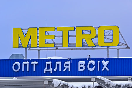 METRO Cash & Carry supermarket signboard on February 10, 2021 in Kiev, Ukraine. It was open in Ukraine in 2003.のeditorial素材
