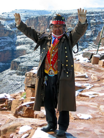 Unknown single indian in national suite and hat in Grand Canyon send welcome to visitors on April 09, 2011 in Arizona, USA.のeditorial素材