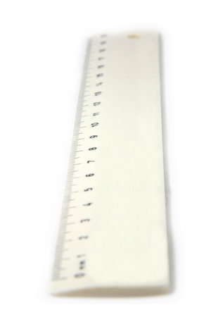 White ruler with selective focus isolated over whiteの写真素材