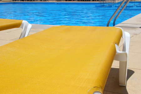 pool restbeds cluseup and blue water background