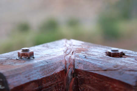 wood angled fence with screws showingの写真素材