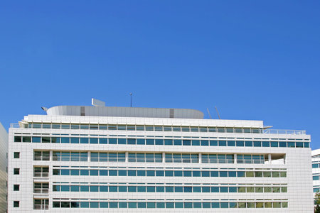 office building against a bright blue sky - put your logo on top