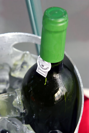 wine bottle on ice chillerの写真素材